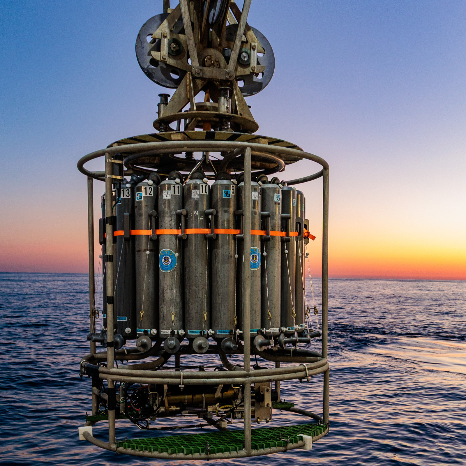 CTD rosette over the ocean at sunset.